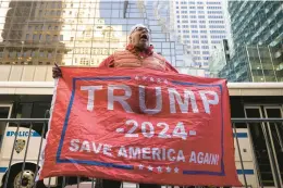  ?? YUKI IWAMURA/AP 2023 ?? A Donald Trump supporter protests outside Trump Tower in New York.