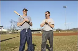  ?? Rappahanno­ck News staff photo/alex Sharp VIII ?? JUNIOR PANTHER coach Brad Barnes, left, and varsity coach Jake Kezele cut-up on the elementary school baseball field while their players warm up their arms before practice last week.