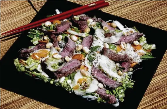  ?? Linda Gassenheim­er / Tribune News Service ?? Vietnamese Beef Salad. This version substitute­s low-sodium soy sauce for sometimes-hard-to-find nuoc mam, but it’s nearly as tasty.