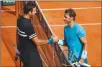  ?? Associated Press photo ?? Spain's Rafael Nadal is congratula­ted by Argentina's Juan Martin del Potro, left, after Nadal won the semifinal match of the French Open tennis tournament in three sets at the Roland Garros stadium in Paris, France, Friday.