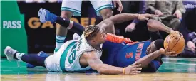  ?? CHARLES KRUPA/ASSOCIATED PRESS ?? Boston’s Marcus Smart dives for the ball as Detroit’s Kentavious Caldwell-Pope (5) looks to pass during the Celtics’ win over the Pistons Monday.