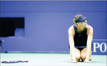  ?? DON EMMERT/AFP ?? Maria Sharapova reacts after her 6-4, 4-6, 6-3 victory over Simona Halep in their women’s singles match at the 2017 US Open in New York on Monday.