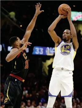  ?? ASSOCIATED PRESS ?? GOLDEN STATE WARRIORS’ KEVIN DURANT (35) SHOOTS over Cleveland Cavaliers’ Tristan Thompson (13) in the second half Monday in Cleveland.