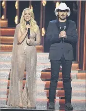  ?? Chris Pizzello Invision / AP ?? CO-HOSTS Carrie Underwood and Brad Paisley at Wednesday night’s CMA Awards in Nashville.