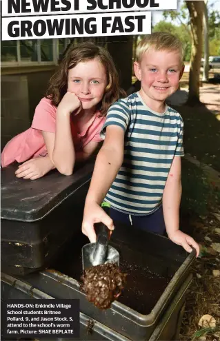  ??  ?? HANDS-ON: Enkindle Village School students Britnee Pollard, 9, and Jason Stock, 5, attend to the school's worm farm. Picture: SHAE BEPLATE