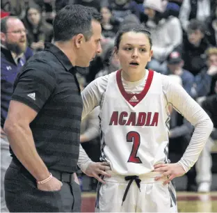  ?? JASON MALLOY ?? Acadia Axewomen head coach Len Harvey talks with guard Haley McDonald during a break in the action in 2023. McDonald, a Port Williams native, will join the Axewomen coach staff for the 2023-24 season.