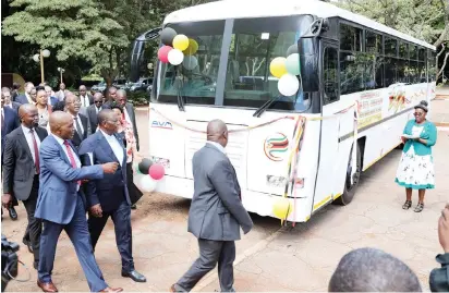  ?? — Picture Innocent Makawa ?? Vice President Dr Constantin­o Chiwenga (centre) is shown a prototype city bus by AVM mananging director Mr Jacob Kupa (right) during the official launch at the Zimbabwe-Belarus Business Forum in Harare yesterday.