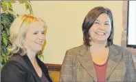  ??  ?? Maxine Rennie, left, executive director of CBDC West Prince Ventures, and Tammy Rix, executive director of the West Prince Chamber of Commerce, review plans for the chamber’s breakfast business mixer on Oct. 19 at the Mill River Experience.