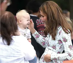  ??  ?? Next generation...Kate meets young families at official garden opening