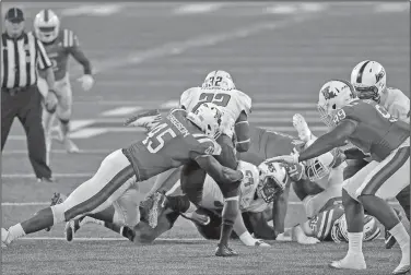  ?? Tom Morris/Louisiana Tech Sports Informatio­n ?? Wreaking havoc: Louisiana Tech defensive end Jaylon Ferguson makes a tackle during a game in 2017. The Bulldogs, winners of four straight bowl games under Skip Holtz, are ready to take aim at the Conference USA crown.