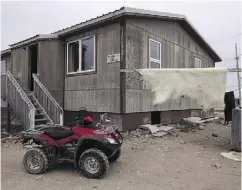  ?? THE CANADIAN PRESS / FILES ?? A polar bear hide dries outside a house in Nunavut. The federal government is expected make a long-term commitment to Indigenous housing in next week’s budget.