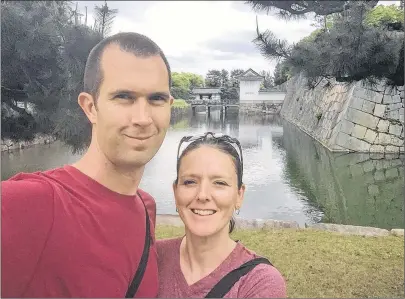  ?? SUBMITTED PHOTO ?? Trevor Davis and Christine Healey stand outside the Nijojo Castle in Kyoto during their visit to Japan. The couple, who quit their high-pressure finance jobs to enjoy life, has just returned from an 18-month world trip.