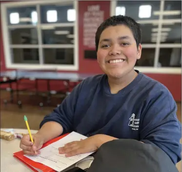  ?? COURTESY OF LIGHTHOUSE YOUTH CENTER ?? A student works on his homework after-school at the Lighthouse Youth Center on Feb. 22.