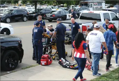  ?? NEWS-SENTINEL PHOTOGRAPH­S BY BEA AHBECK ?? A man is treated by emergency personnel after being injured in a fight outside the Lodi Grape Bowl on Saturday. Two people were transporte­d to the hospital after a fight broke out outside the Lodi Grape Bowl on Saturday afternoon, as an exhibition game between two soccer teams were taking place.