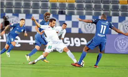  ?? Supplied photo ?? Al Nasr and Emirates players clash during the Arabian Gulf League match on Thursday. The Blues won 1-0. —