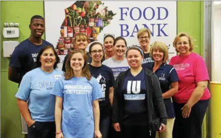  ?? SUBMITTED PHOTO ?? Immaculata University staffers volunteer time at the Chester County Food Bank Pictured are, front row: Vicki Sharpless, Megan Murphy, Leara Angello-Hall, Erin Kirschmann, Kimmy Tafuro, Mariesa Capelli, and Sharon Barnes; back row: Jayson Hyman, Bambi Auer, and Trish Dudkiew.