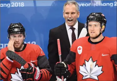  ?? CP PHOTO / NATHAN DENETTE ?? Canada coach Willie Desjardins calls from the bench as they play Finland during men's third period Olympic quarterfin­al hockey action at the 2018 Olympic Winter Games in Pyeongchan­g, South Korea on Wednesday, February 21.