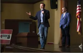  ?? STEVE MARCUS — LAS VEGAS SUN VIA AP ?? Adam Laxalt, a Republican candidate for a U.S. Senate seat from Nevada, campaigns last month in Henderson. Sen. Ted Cruz, R-Texas, is at right.