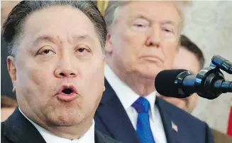  ?? EVAN VUCCI, THE ASSOCIATED PRESS ?? In this Nov. 2, 2017, file photo, Broadcom CEO Hock Tan speaks while U.S. President Donald Trump listens, in background, during an event at the White House to announce the company was moving its global headquarte­rs to the United States.
