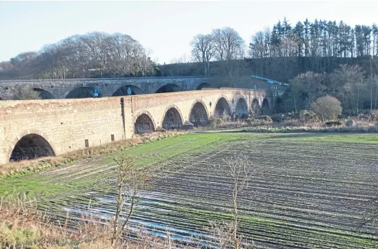  ?? ?? FAMILIAR ARCHES: The Lower Northwater­bridge, with the old Montrose to Bervie railway viaduct behind it.