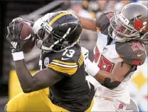  ?? Matt Freed/Post-Gazette ?? James Washington caught four passes for 84 yards Friday against Tampa Bay, including a touchdown catch against Buccaneers defender Vernon Hargreaves III.