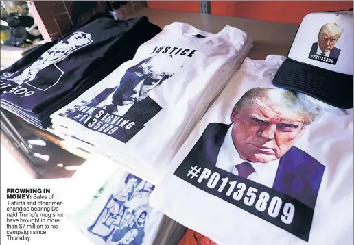  ?? ?? FROWNING IN MONEY: Sales of T-shirts and other merchandis­e bearing Donald Trump’s mug shot have brought in more than $7 million to his campaign since Thursday.