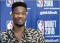  ?? MARY ALTAFFER — THE ASSOCIATED PRESS ?? Arizona’s Deandre Ayton won’t have to wait long to hear his named called Thurday when the NBA Draft gets underway. The 7-0 center is expected to be overall No. 1 pick by the Phoenix Suns.The only certainty in Thursday night’s NBA Draft is that the Phoenix Suns will take Arizona center Deandre Ayton with the overall No. 1 pick. The only other sure bet is that the majority of the players taken in the first round will be one-anddone guys.After that, it’s a crapshoot. Will Duke’s Marvin Bagley III go No. 2 or will the Sacramento Kings take 19-year-old Slovevian sensation Luka Donic, the