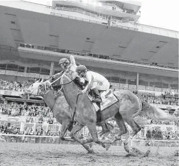  ?? Al Bello / Getty Images ?? Jockey Irad Ortiz Jr. celebrates atop Creator after just edging out Destin and jockey Javier Castellano, right, in the 148th Belmont Stakes at Belmont Park on Saturday.