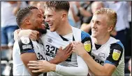  ??  ?? DERBY DELIGHT: Max Bird (centre) celebrates
with Nathan Byrne (left) and Louie Sibley