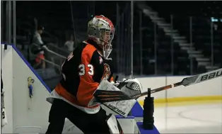  ?? NEWS PHOTO JAMES TUBB ?? Medicine Hat Tigers goaltender Ethan McCallum enters the ice for warmup ahead of the Tigers 5-4 overtime preseason win against the Lethbridge Hurricanes at Co-op Place on Sept. 10.