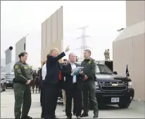  ?? AP PHOTO ?? President Donald Trump reviews border wall prototypes, Tuesday, in San Diego.