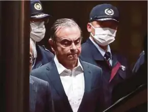  ?? AFP PIC ?? Former Nissan chairman Carlos Ghosn leaving the Tokyo Detention House following his release on bail in Tokyo last night.