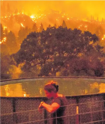  ?? Photo / AP ?? Angela Crawford decided to stay to defend her home from the Mckinney Fire.