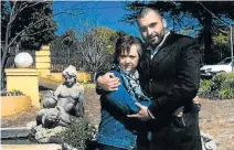 ?? Picture: MAHAYNI FAMILY Picture: AFP ?? GENUINE: Syrian asylum seeker Murhaf Mahayni and his wife, Ann. Home affairs labelled him a fraud for claiming his life was in danger in Syria HOME FIRES: Smoke rises from buildings after air strikes in Damascus, where Mahayni hails from