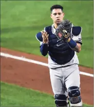  ?? Adrian Kraus / Associated Press ?? Yankees catcher Gary Sanchez looks at his glove after dropping a foul hit against the Jays on Sept. 8.