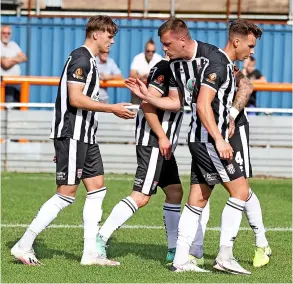  ??  ?? The players celebrate Cody Cooke’s first penalty of the afternoon