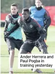  ??  ?? Ander Herrera and Paul Pogba in training yesterday