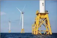  ?? Michael Dwyer / Associated Press file photo ?? Offshore wind turbines near Block Island, R.I. One of two major climate bills signed by Gov. Ned Lamont this week aims to supply all of the state’s power from clean energy sources such as offshore wind by the year 2040.