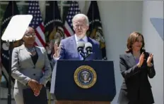  ?? Manuel Balce Ceneta/Associated Press ?? Vice President Kamala Harris, right, applauds Monday as President Joe Biden speaks in the Rose Garden of the White House in Washington during an event on lowering the cost of high-speed internet.
