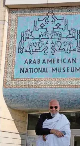  ??  ?? In this photo provided by Arab American National Museum, Ayman Yossri Daydban, who is the museum’s current artist in residence, poses for a photo in front of the museum. — AP photos