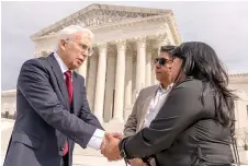  ?? ?? On Wednesday, attorney Eric Schnapper, left, talks with Beatriz Gonzalez, right, the mother of 23-year-old Nohemi Gonzalez, a student killed in the Paris terrorist attacks, and stepfather Jose Hernandez, second from right, in front of the Supreme Court in Washington, after the Supreme Court heard oral arguments in Twitter v. Taamneh. (AP photo/Andrew Harnik)