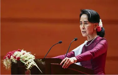  ?? — AP ?? Speaking up:
Suu Kyi delivering a televised speech to the nation at the Myanmar Internatio­nal Convention Center in Naypyitaw. In the address, Suu Kyi said her country does not fear internatio­nal scrutiny.