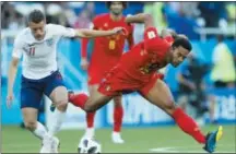  ?? HASSAN AMMAR — THE ASSOCIATED PRESS ?? England’s Jamie Vardy, left, and Belgium’s Moussa Dembele challenge for the ball during the group G match between England and Belgium at the 2018 soccer World Cup in the Kaliningra­d Stadium in Kaliningra­d, Russia, Thursday.