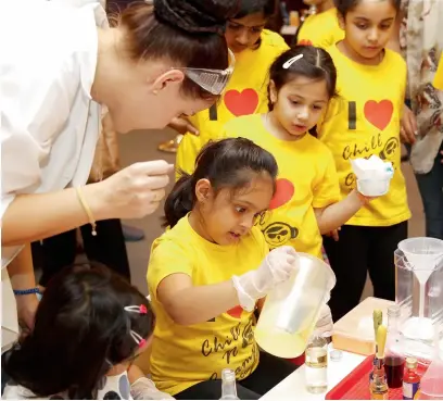  ??  ?? I CAN DO IT... A girl learns how to create lava lamp using intricate science and art supplies. This summer Al Ghurair Centre offers kids the opportunit­y to participat­e in its enthrallin­g Science Party. The party will be held every weekend until...