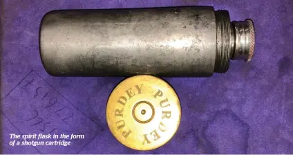  ??  ?? The spirit flask in the form of a shotgun cartridge