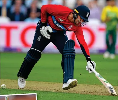  ?? GETTY IMAGES ?? Controvers­y: Roy is struck on the heel and shows his frustratio­n (left) after being given out for obstructin­g the field