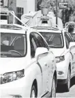  ?? ERIC RISBERG, AP ?? Google self-driving cars in Mountain View, Calif.