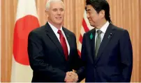  ?? AFP ?? Shinzo Abe and Mike Pence shake hands prior to a luncheon hosted by Abe at the prime minister’s official residence in Tokyo. —