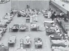  ?? U.S. LIBRARY OF CONGRESS ?? Volunteer nurses tend to influenza patients in the Oakland, Calif., in 1918. Labs around the world are seeking better vaccines to boost protection against the flu and future pandemics.
