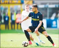  ??  ?? Inter Milan’s Italian defender Danilo D’Ambrosio vies with AC Milan’s Spanish forward Gerard Deulofeu during the Italian Serie A football match Inter Milan vs AC Milan at the San Siro Stadium in Milan on
April 15. (AFP)